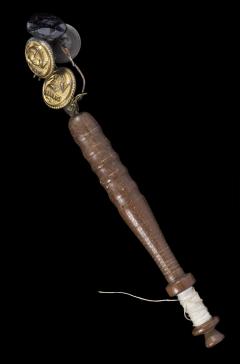 1918.16.29 Wooden lace bobbin with bead and button weights