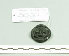 1960.7.1 .123 Black brooch made of bakelite. Made to imitate jet and to be worn during mourning.