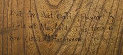 1910.42.15 Inscription on back of stool bat