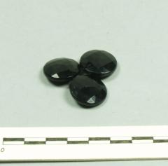 1960.7.1 .25-.27 The buttons are made of black glass to imitate jet, to be worn during mourning.